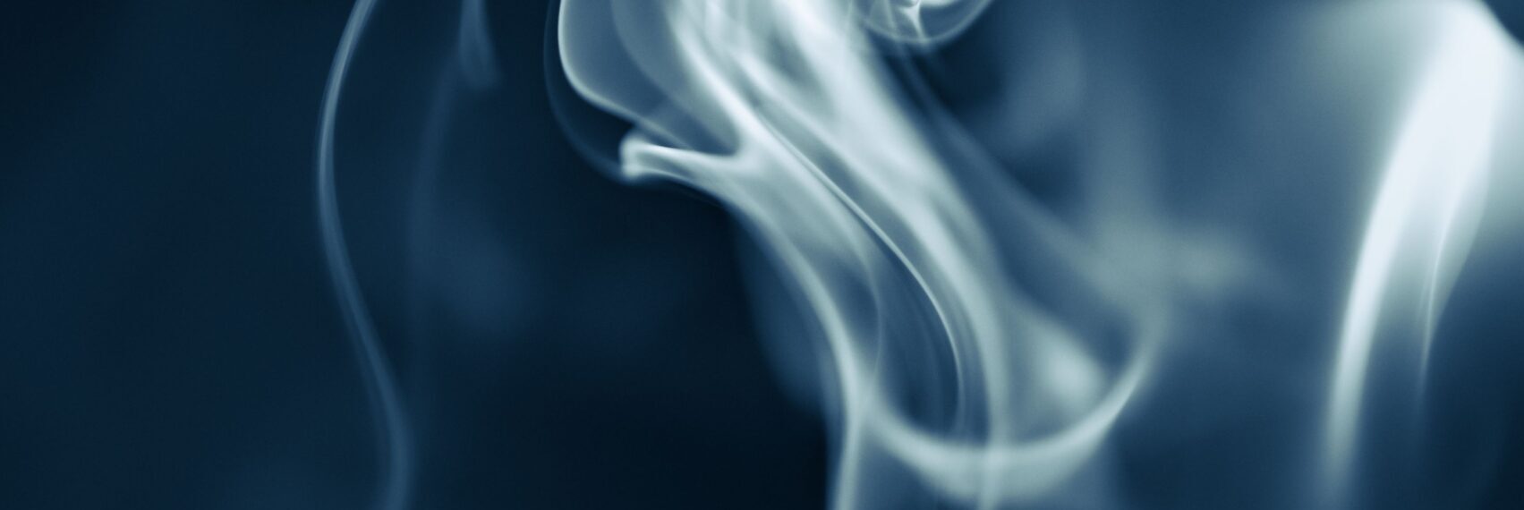 Soft, swirling smoke design in abstract blue tones conveying mystery and elegance.
